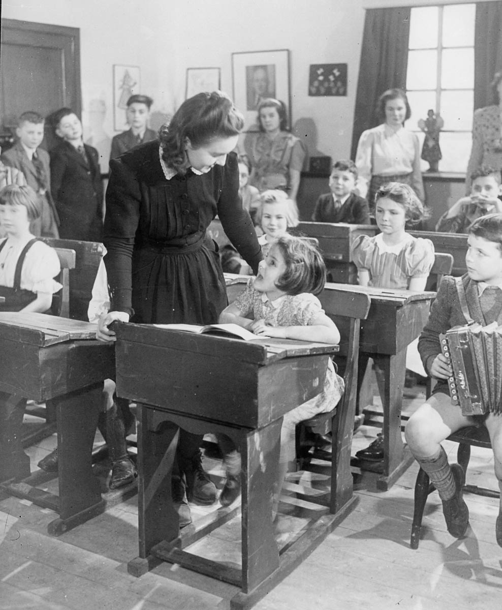 circa 1935: A little girl at a Czech school obviously enjoys her lesson. (Photo by General Photographic Agency/Getty Images)